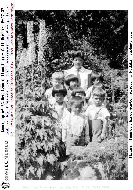 Whonnock kindergarten class, T. Hedaka, tacher, posed in a garden.